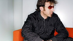 man in black zippered jacket