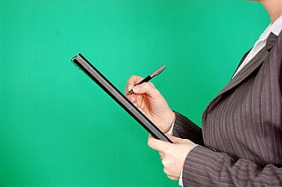 woman holding pen HD wallpaper