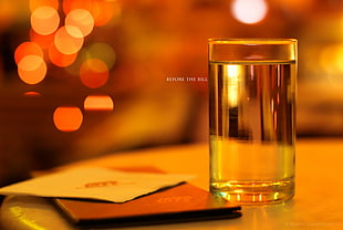 selective focus photography of drinking glass