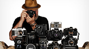 assorted DSLR cameras, Nikon, men, camera, hat