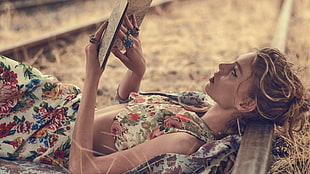 tilt lens photography of woman reading book HD wallpaper