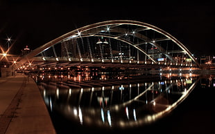 gray steel bridge with lights during nighttime