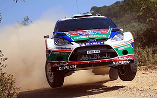 white, green and red Ford Focus WRC Rally Car, sports