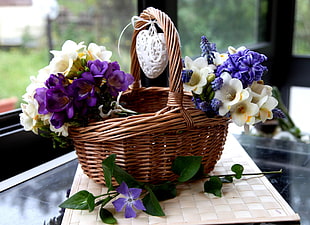 bouquet of white and purple petaled flower on brown basket HD wallpaper