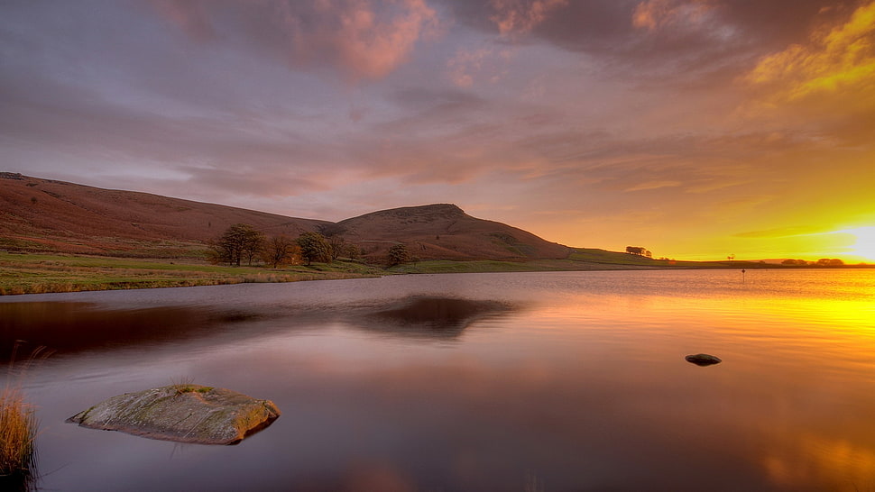 brown mountain during golden hour HD wallpaper
