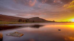 brown mountain during golden hour HD wallpaper
