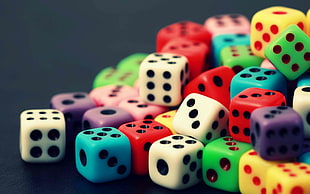 tilt-shift lens photo of variety colored dice