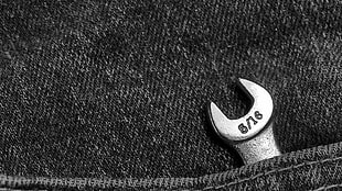 5/16 silver open wrench, monochrome, jeans, pocket, tools
