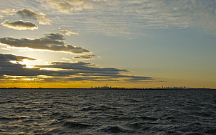 body of water, cityscape, sky, sunset, clouds