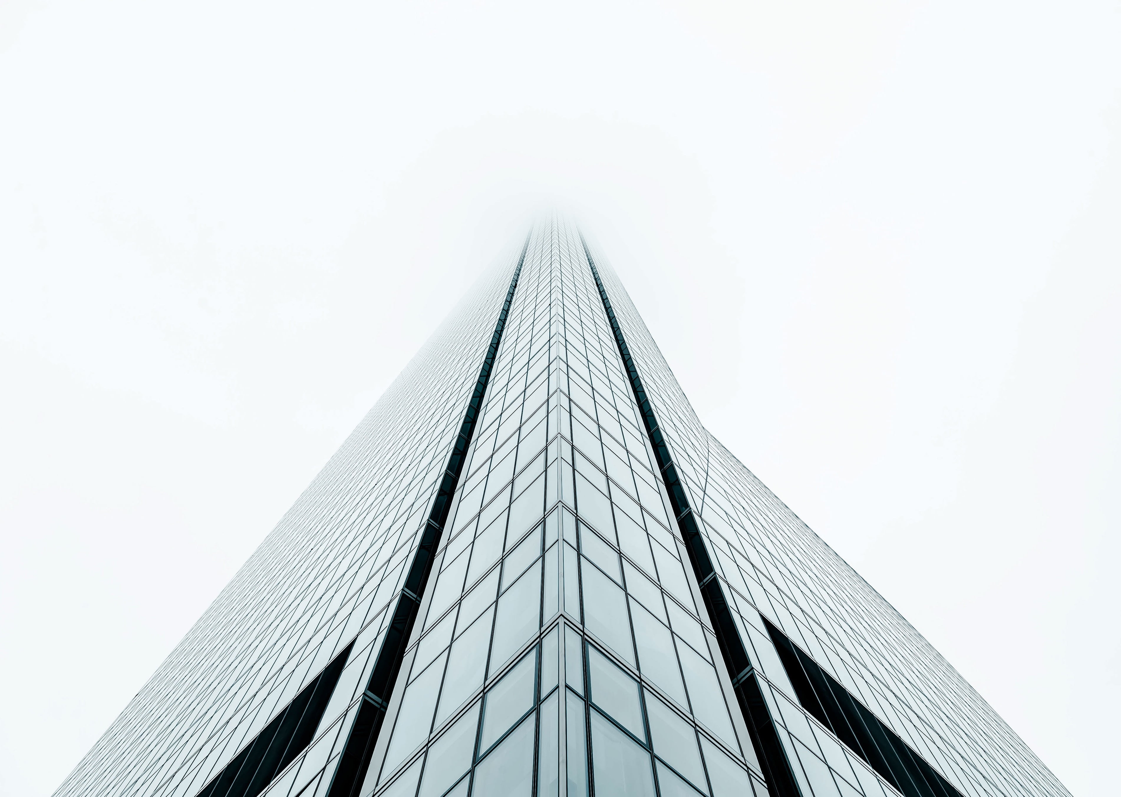 Photography Of High Rise Building Under Gray Sky During Daytime Hd