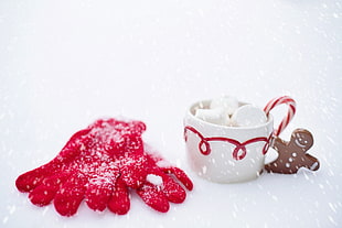 pair of red gloves on snow during day time HD wallpaper