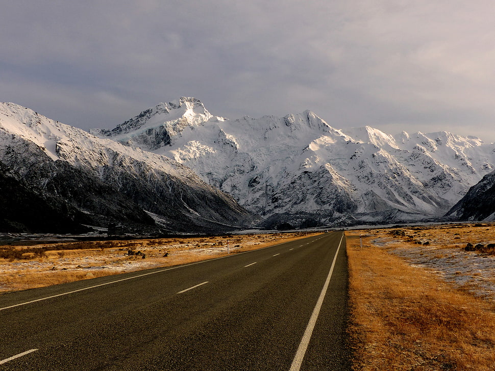 gray concrete road surround by black and white rocky mountain with snow, sefton HD wallpaper