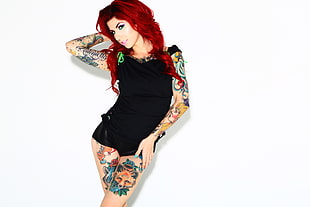 woman in black camisole filled with tattoo