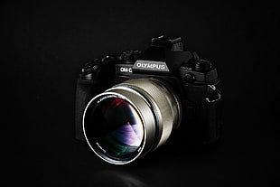 black and silver Olympus DSLR camera