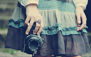 girl holding DSLR camera