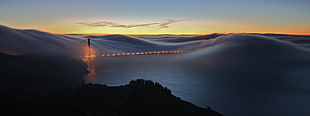 gray mountain, bridge, mist, sea, lights HD wallpaper