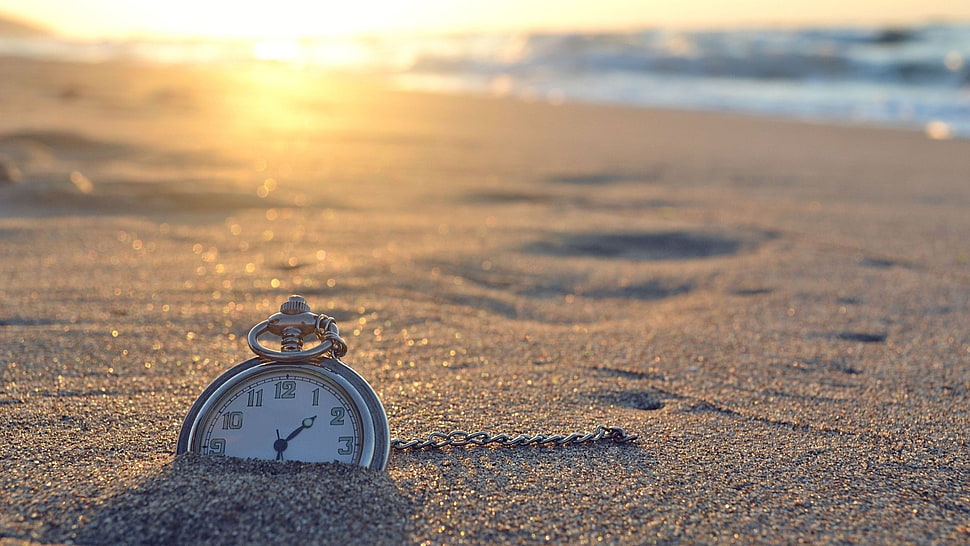 round silver-colored analog pocket watch, clocks, beach, sand, sunlight HD wallpaper