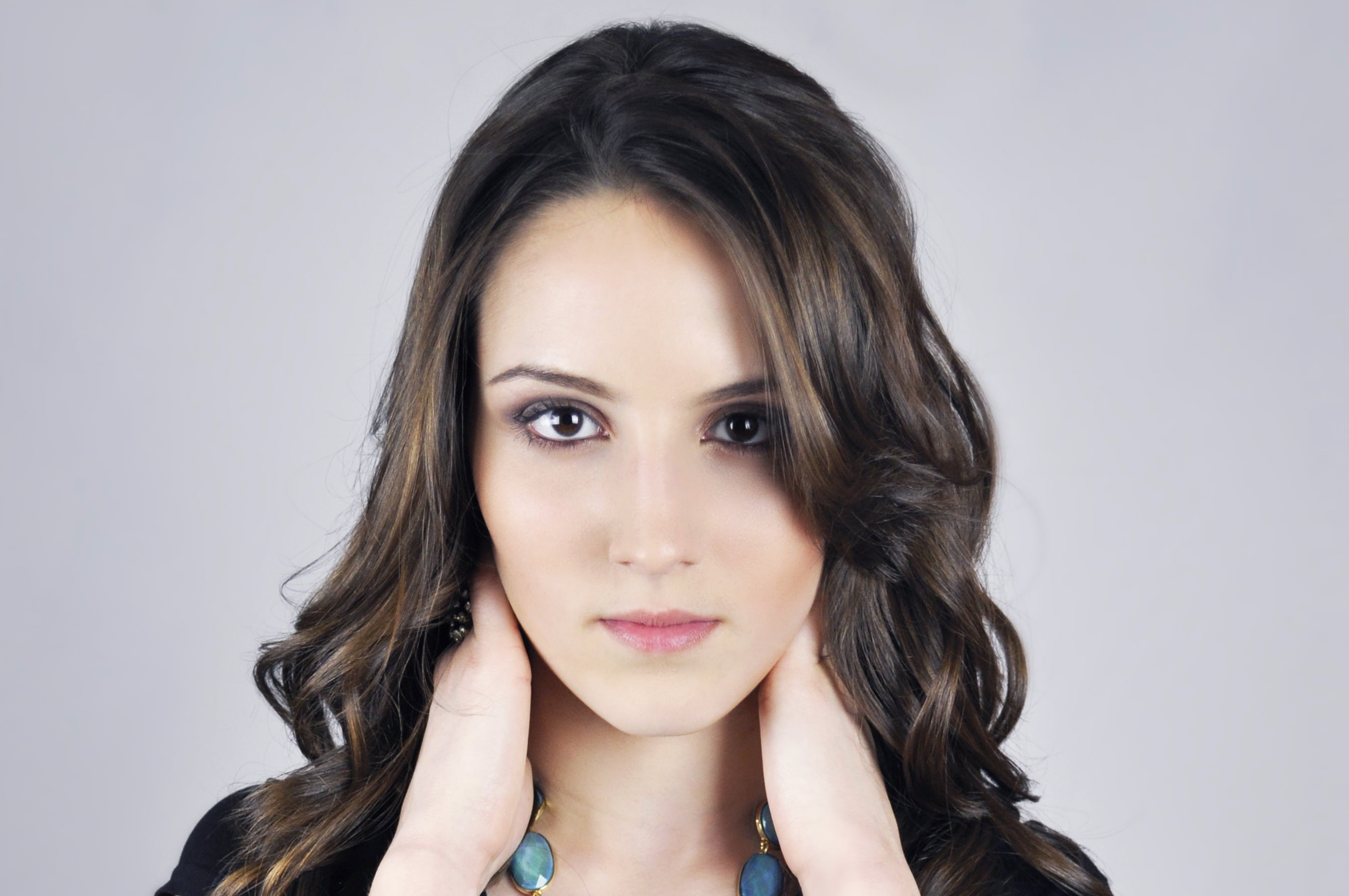 woman holding her neck photo