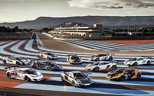 ten racing cards in racing field at daytime HD wallpaper