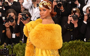 Rihanna wearing yellow fur top