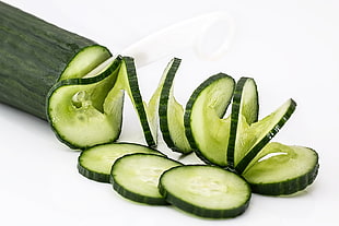 sliced cucumber on white surface HD wallpaper