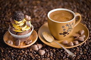 beige floral ceramic teacup with coffee