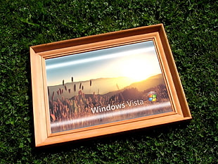 beige wooden framed photo of Windows Vista HD wallpaper