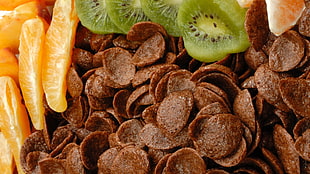 chocolate cereal with sliced kiwi and oranges HD wallpaper