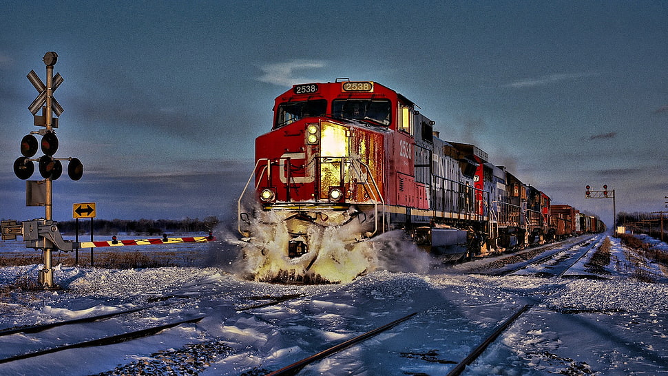 red train near road signage HD wallpaper