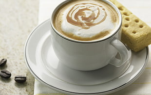 brown cappuccino on white ceramic mug
