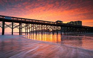black metal bridge, sunset, pier, beach, clouds