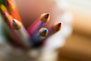 selective photo of coloring pencils