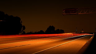 time lapse photo of cars creating light streaks HD wallpaper