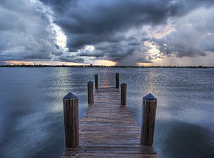 time lapse photography of dock and nimbus clouds HD wallpaper