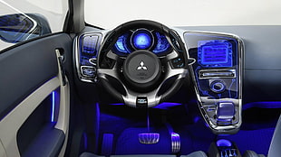 black turned on Mitsubishi car interior with blue lights