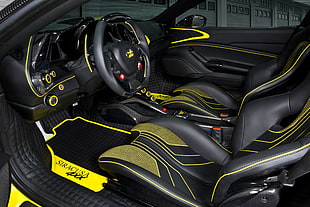 vehicle interior with black and yellow bucket seat and mat