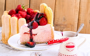 strawberry on top moist cake served on white ceramic plate HD wallpaper
