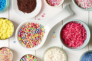 three round white and red ceramic plates, sweets, sprinkles