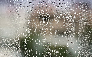 macro shot photography of rain drops on glass window