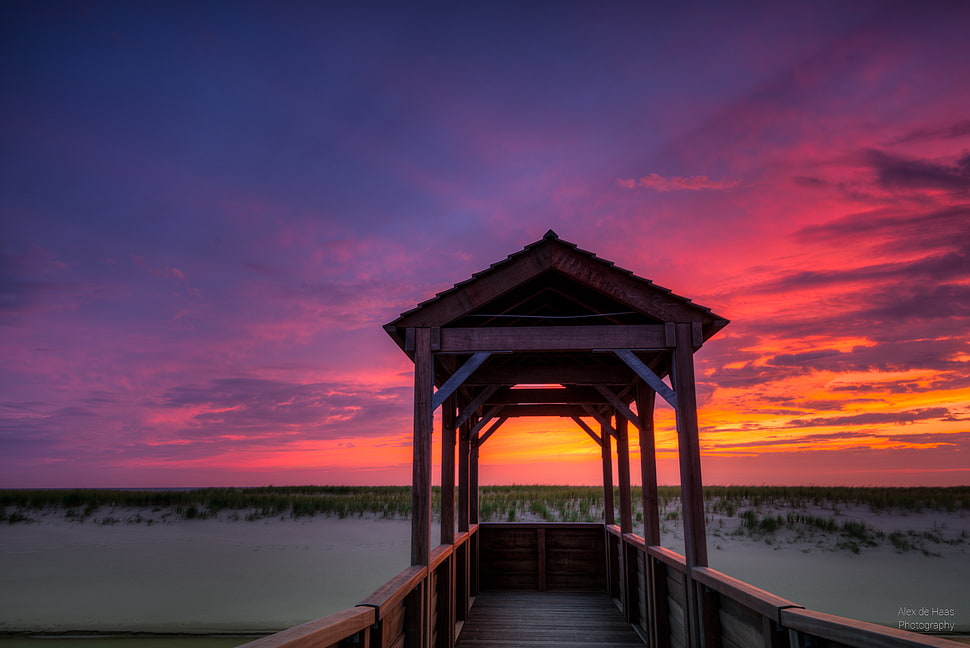 brown gazebo at the end of sea dock during golden hour HD wallpaper