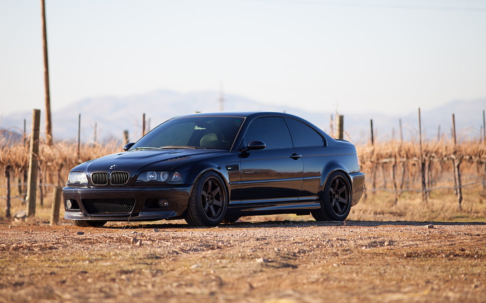 black BMW E46 parked on dirt road during daytime HD wallpaper