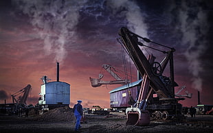 man standing near industrial machine photo, landscape, pollution, machine, work HD wallpaper