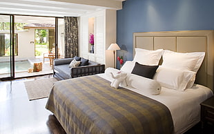 bedroom furniture set with open sliding door near pool