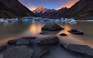 body of water high contrast photo, mountains, ice, stones, landscape HD wallpaper