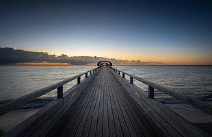 brown and black wooden bed frame, pier, sea, water, sky