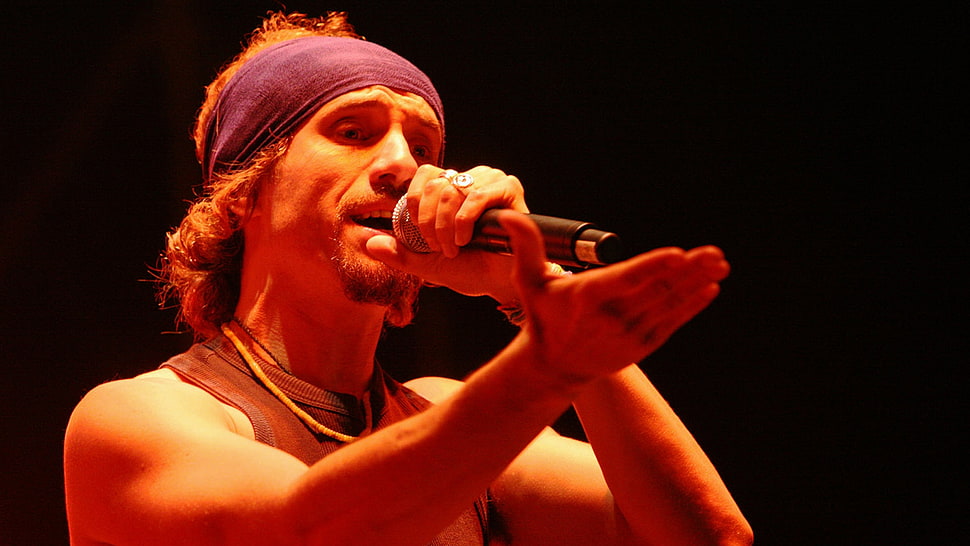 man holding black wireless microphone HD wallpaper