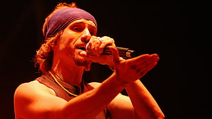 man holding black wireless microphone