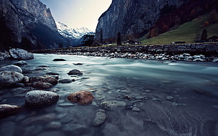 time lapse photography of river within mountain range during daytime