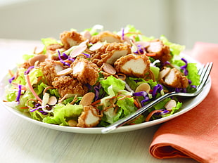 vegetable salad with slice of fried chickens