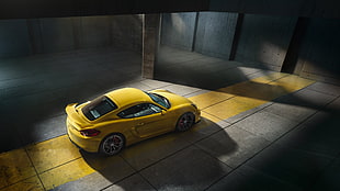 yellow coupe in garage